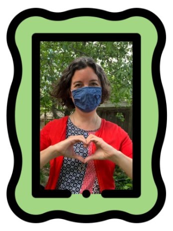 Daphne Fedoruk, making a heart shape using her hands and wearing a blue face mask
